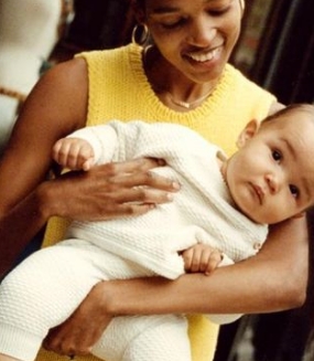 Image of a woman holding a baby.